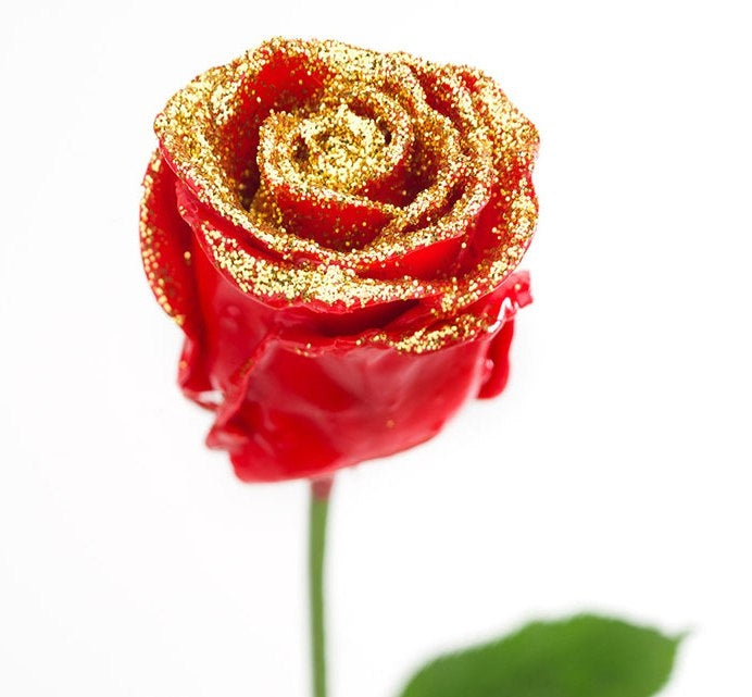 Bouquet of large -flowered wax roses red with golden glitter