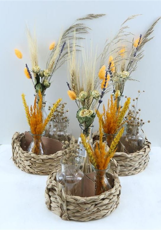 Basket with 3 bottles with orange dry flowers arrangements